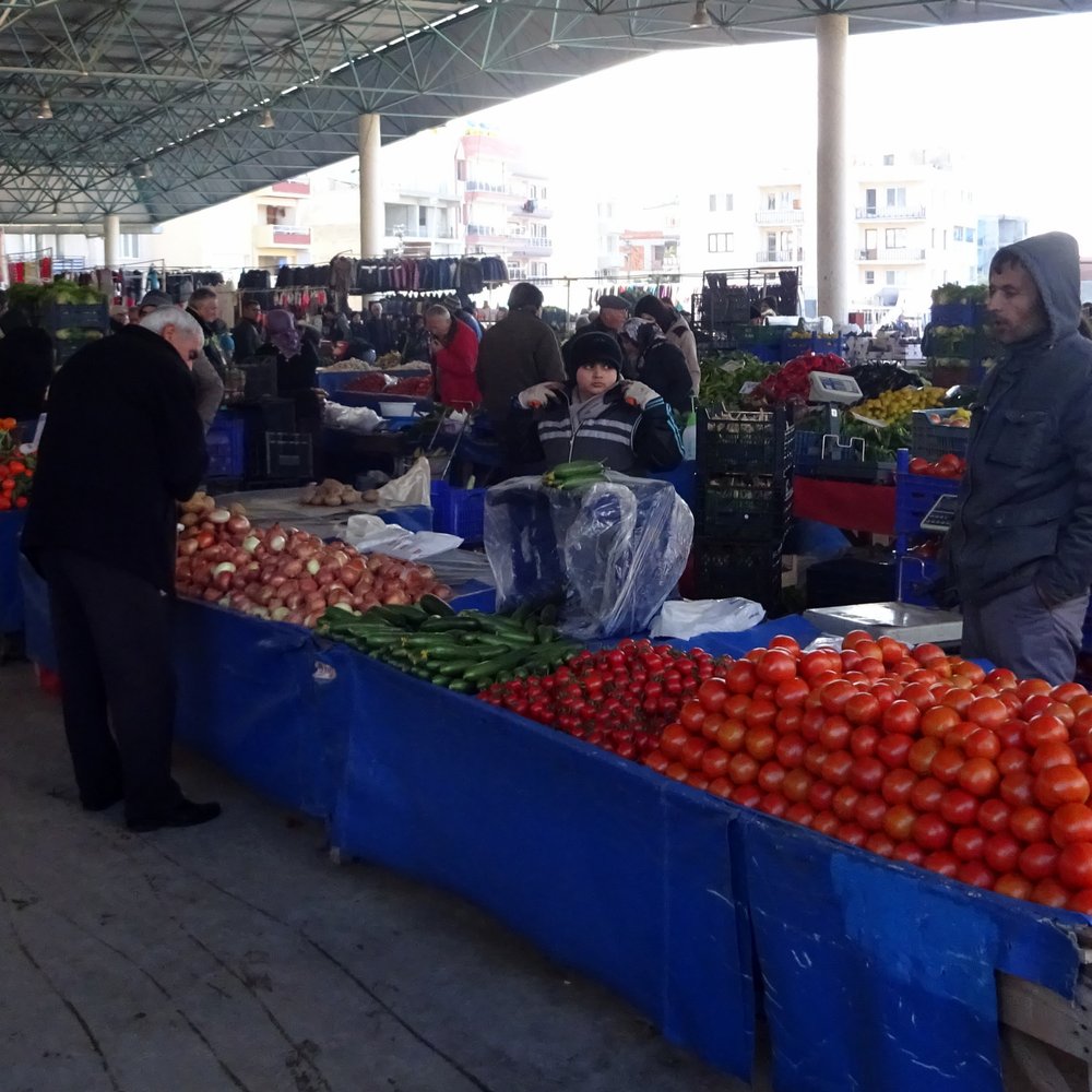 Stalls with fruit and vegetables at a weekly market near Akbuk