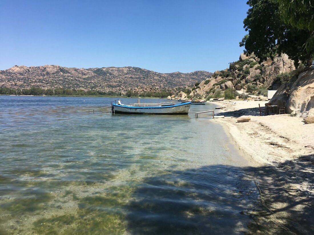 Wide view of Akbuk bay with calm turquoise water and hills