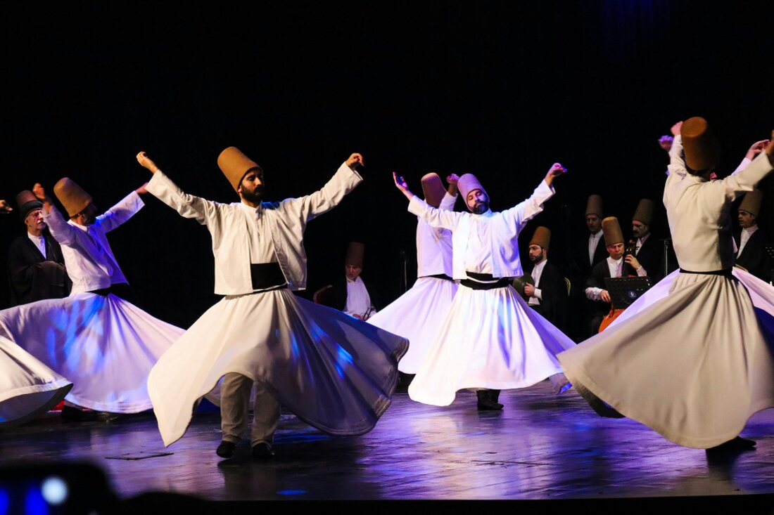 People dancing at an outdoor cultural festival in Turkey at night